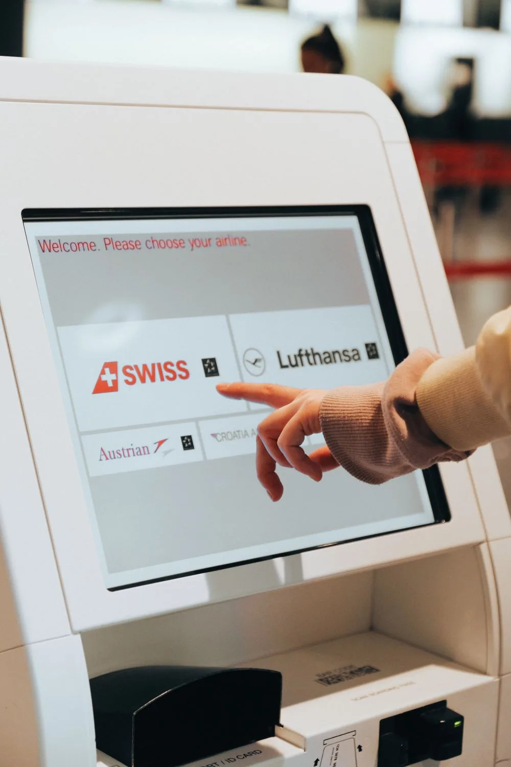 Person using a freestanding touch-screen kiosk