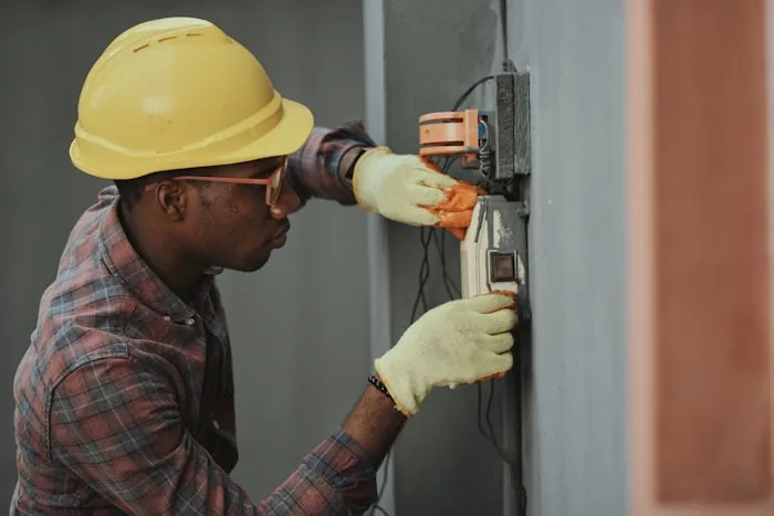 Licensed electrician installing wiring in Singapore