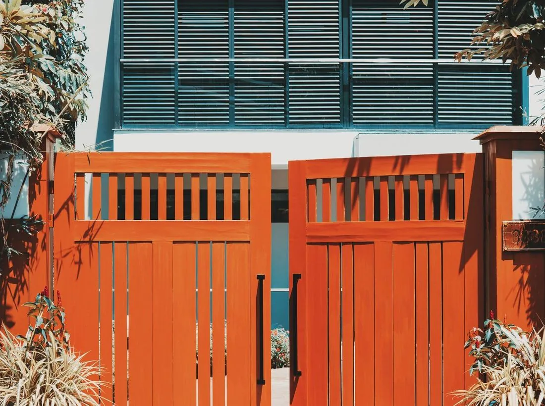 A timber and steel gate of a landed home, the pillar where the door station is mounted