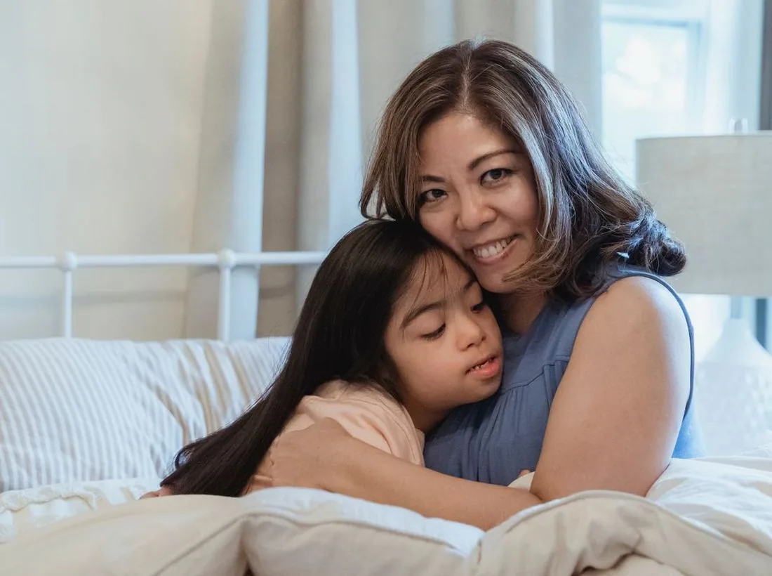 A mother and daughter at home in Singapore, the family a video intercom system is installed for
