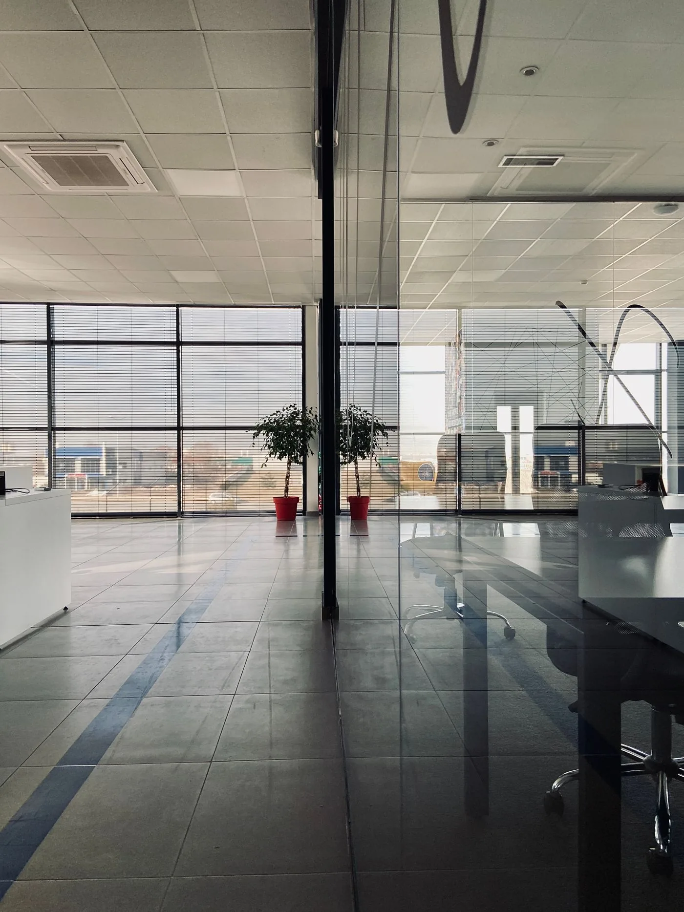 Glass office partition walls in a Singapore workplace