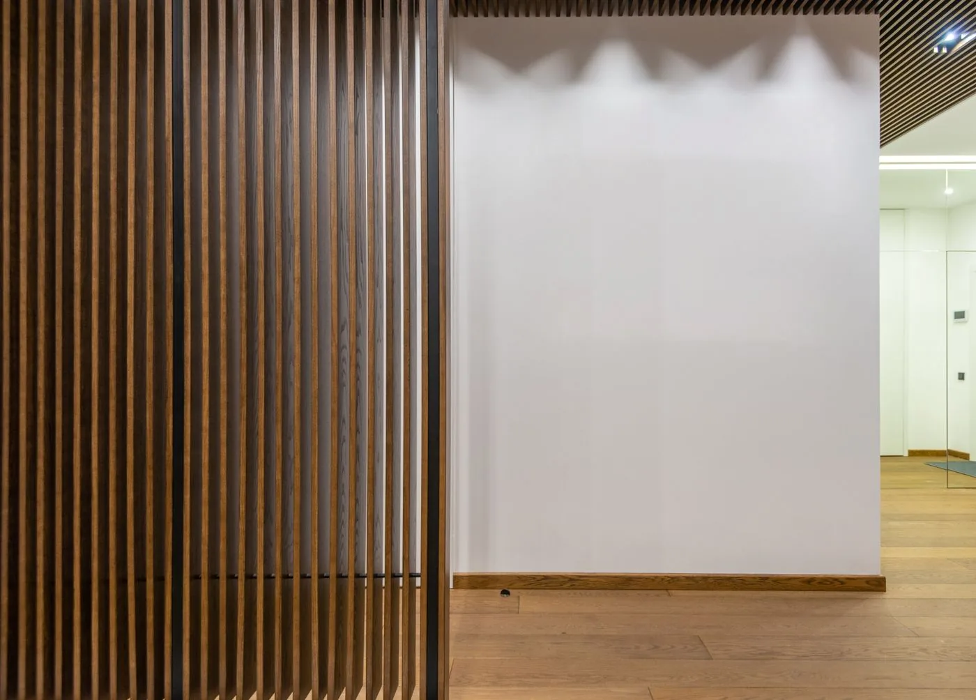 Wooden slat partition divider in a modern Singapore interior
