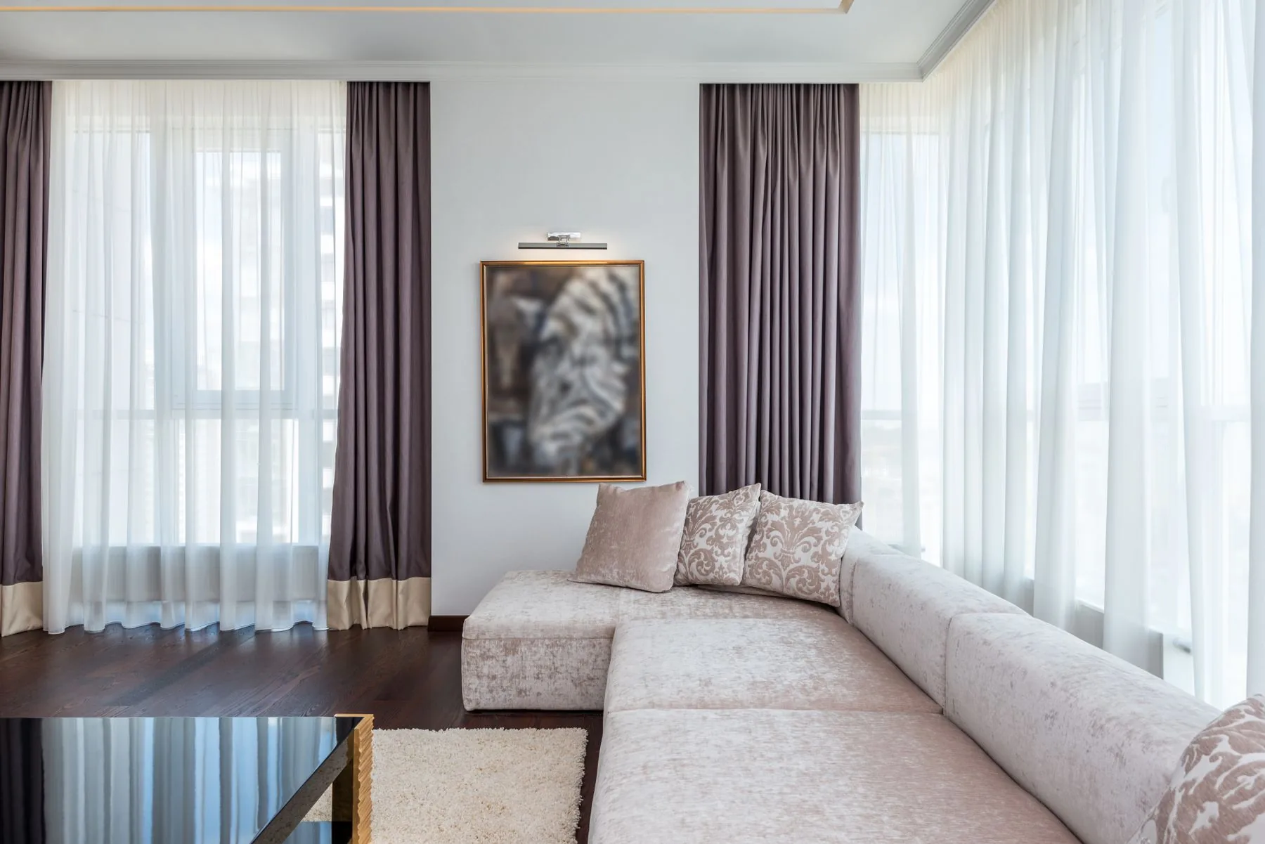 Bright Singapore living room with motorised smart curtains across large windows