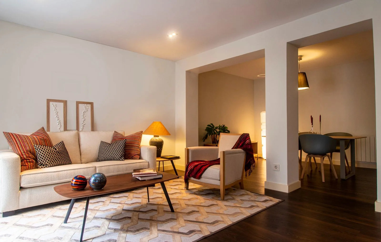 Modern Singapore living room with warm smart lighting controlled by a single smart home hub