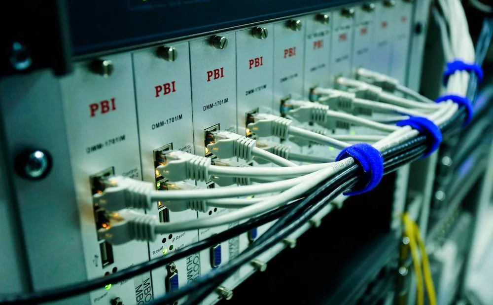 Signal processing modules with neatly dressed network cables in an equipment rack